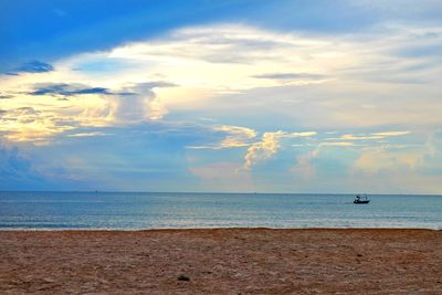 Scenic view of sea against sky at sunset