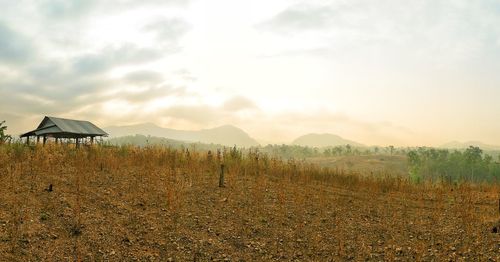 Scenic view of field against sky during sunset