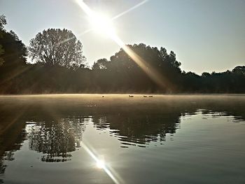 Scenic view of lake during sunset