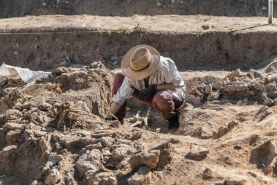 Man working on rock