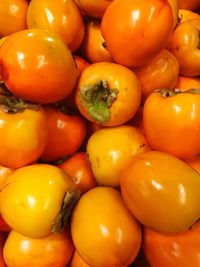 Full frame shot of persimmons for sale at market stall