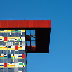 Low angle view of building against clear blue sky