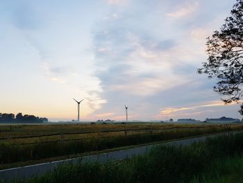Scenic view of field against sky during sunset