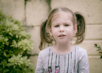 Portrait of cute girl standing outdoors