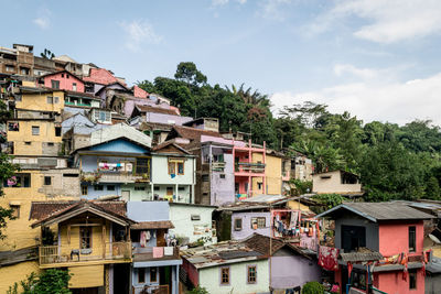 Buildings in town against sky