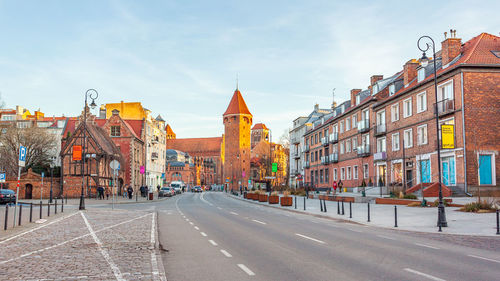 Buildings in city against sky