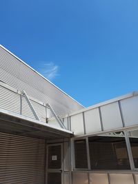 Low angle view of building against blue sky