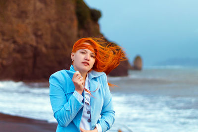 Portrait of young woman at beach