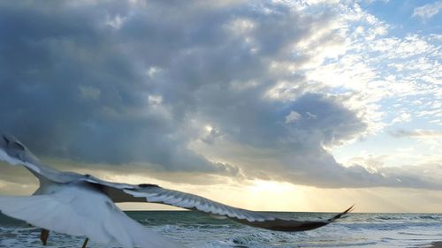 Scenic view of sea against cloudy sky