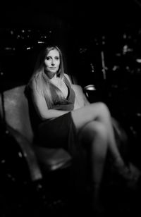 Beautiful young woman sitting on seat