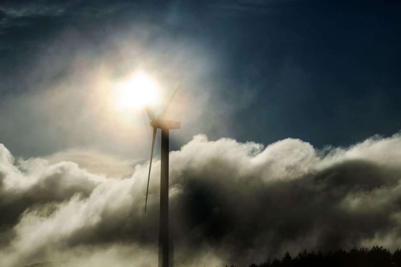 LOW ANGLE VIEW OF WINDMILL ON SUNNY DAY AGAINST SKY