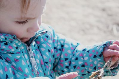 Close-up of cute girl holding hands