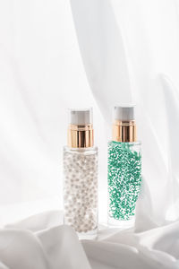 Close-up of bottles on white background