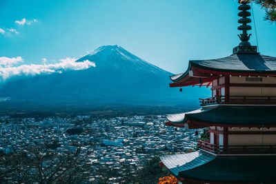 Scenic view of sea and mountains against sky