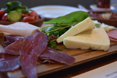 Close-up of sandwich and bread on plate