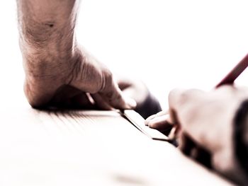 Midsection of man working at table