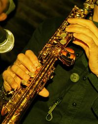 Close-up of man playing piano