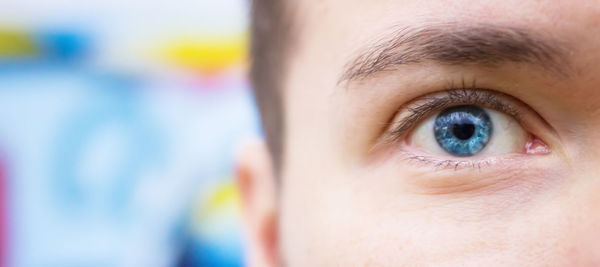 Close-up portrait of cropped woman eye
