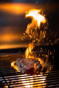 Beautiful grilled steak with sparks of fire