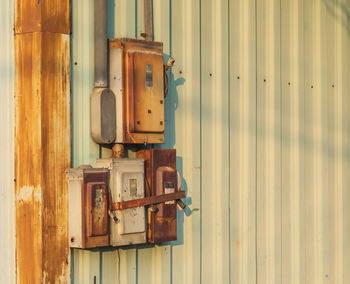 Close-up of electrical equipment on wall