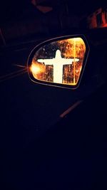 Close-up of illuminated car windshield at night