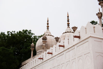 Low angle view of mosque against clear sky