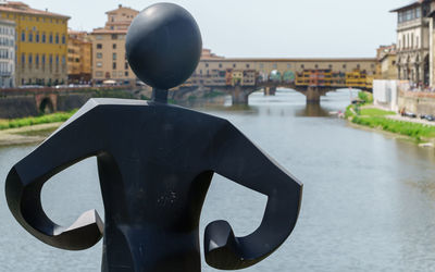 Rear view of woman holding water