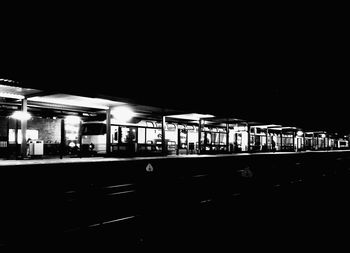 Illuminated subway station platform at night