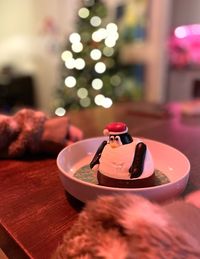 Close-up of christmas decoration on table at home