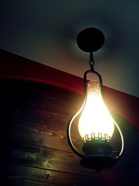 Low angle view of lit light bulb