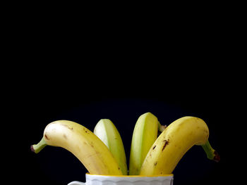 Close-up of fruits against black background