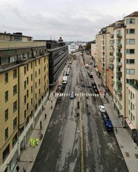 High angle view of street amidst buildings in city