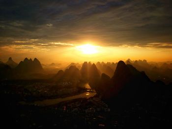 Scenic view of mountains against sky during sunset