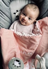 High angle view of cute baby boy sleeping on bed at home