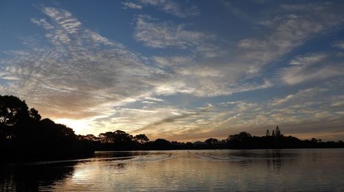 Scenic view of lake against sky during sunset