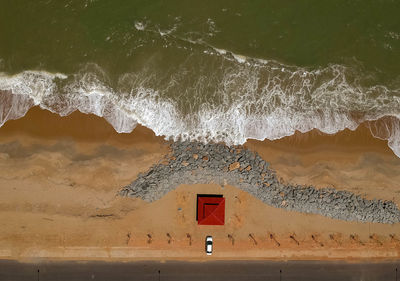 Lifeguard hut on beach by sea