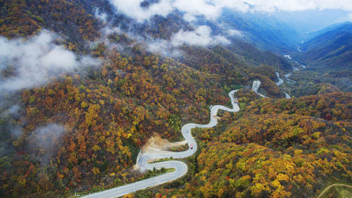 High angle view of road amidst mountains against sky