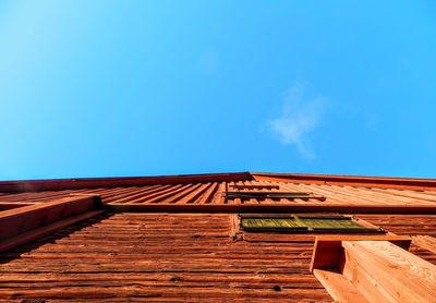 Low angle view of building against blue sky