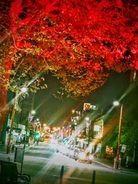 Cars on city street at night