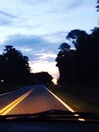 View of country road through car windshield