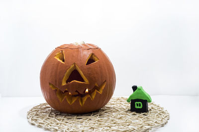 Close-up of pumpkin against gray background