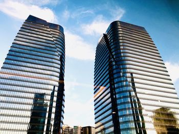 Low angle view of modern buildings against sky