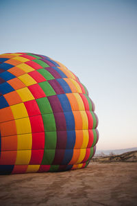 Multi colored hot air balloon on mountain