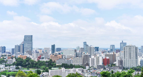 Modern buildings in city against sky