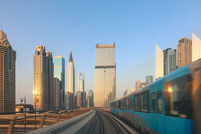 Metro system. view from window of subway car in dubai in evening rays of sunset. underground station 