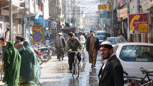 People walking on street in city