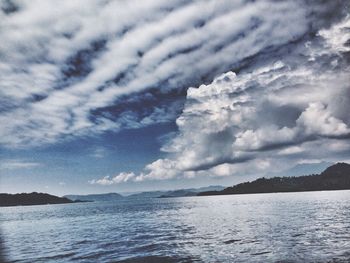 Scenic view of sea against cloudy sky