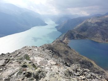 Scenic view of lake and mountains against sky