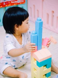 Close-up of boy playing with toy blocks