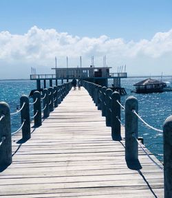 Pier over sea against sky